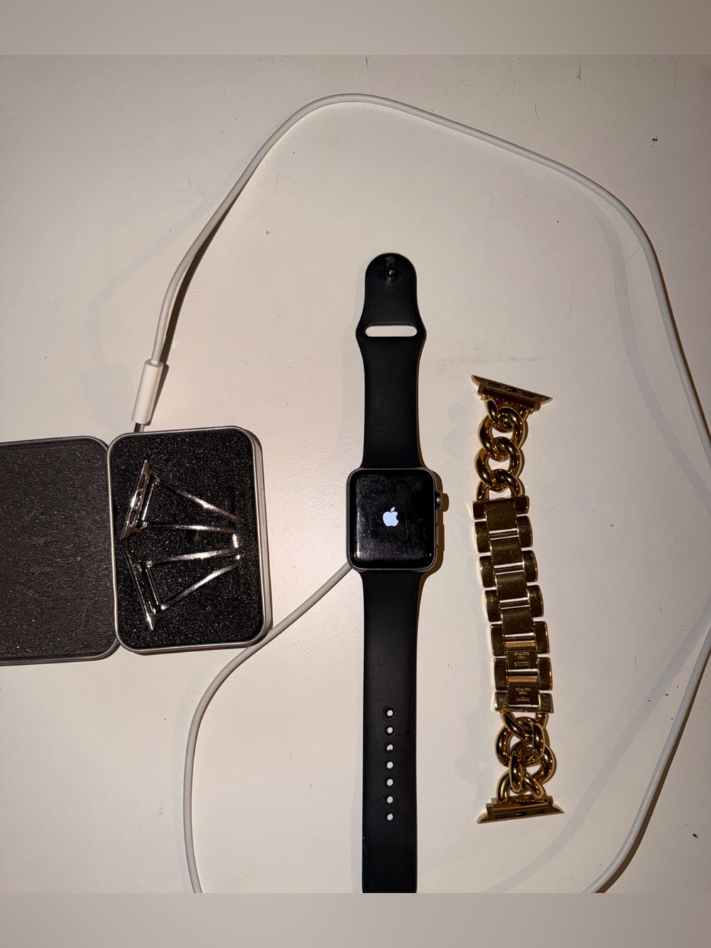 Apple Watch Series 3 with Black Sport Band and Gold Link Bracelet